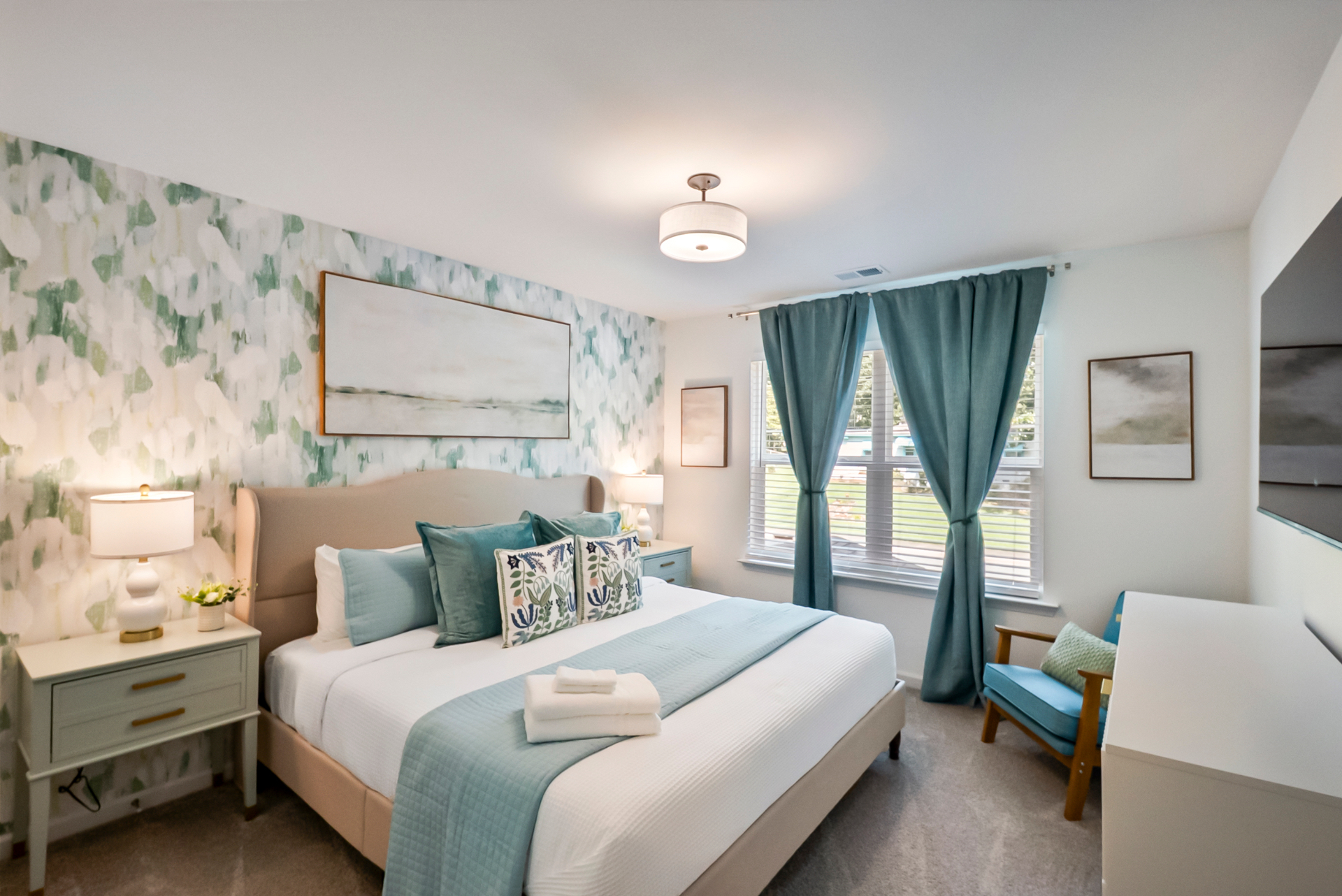 Guest bedroom with coastal-inspired wallpaper