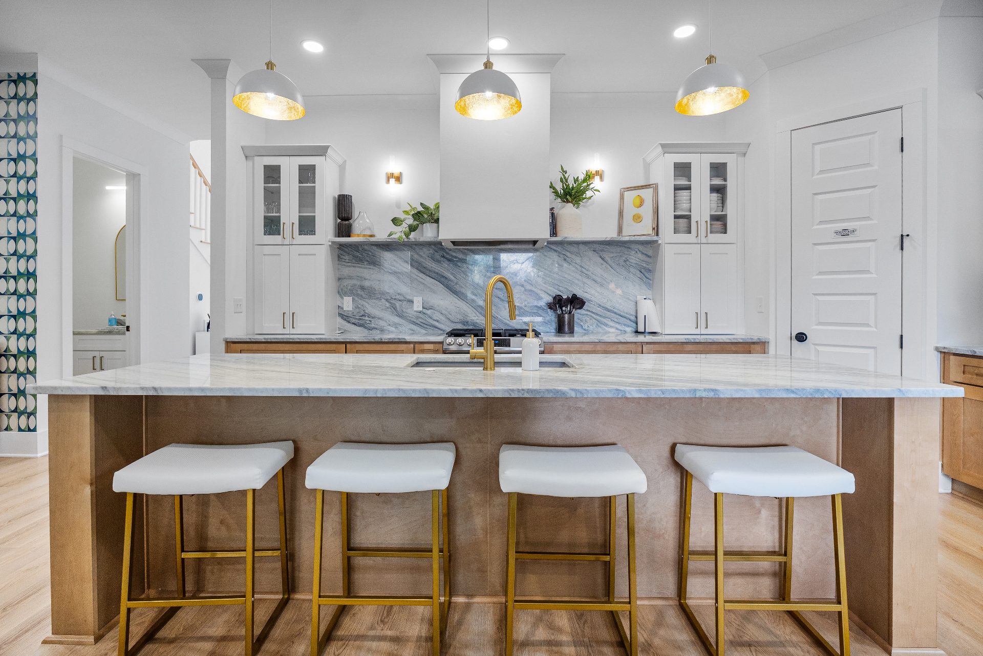 Luxury Charlotte STR kitchen with marble island and gold accents