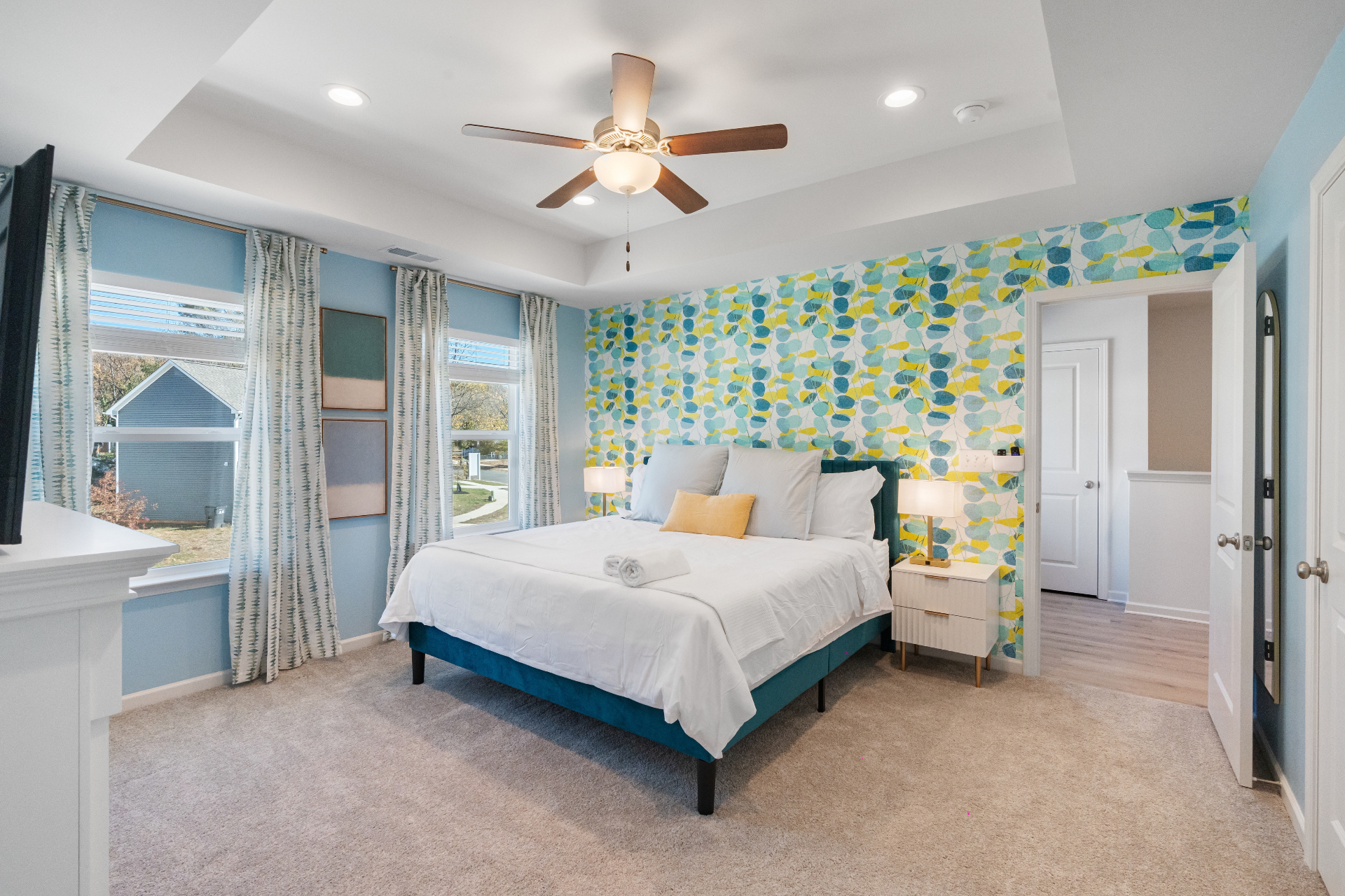 Boutique bedroom with patterned accent wall