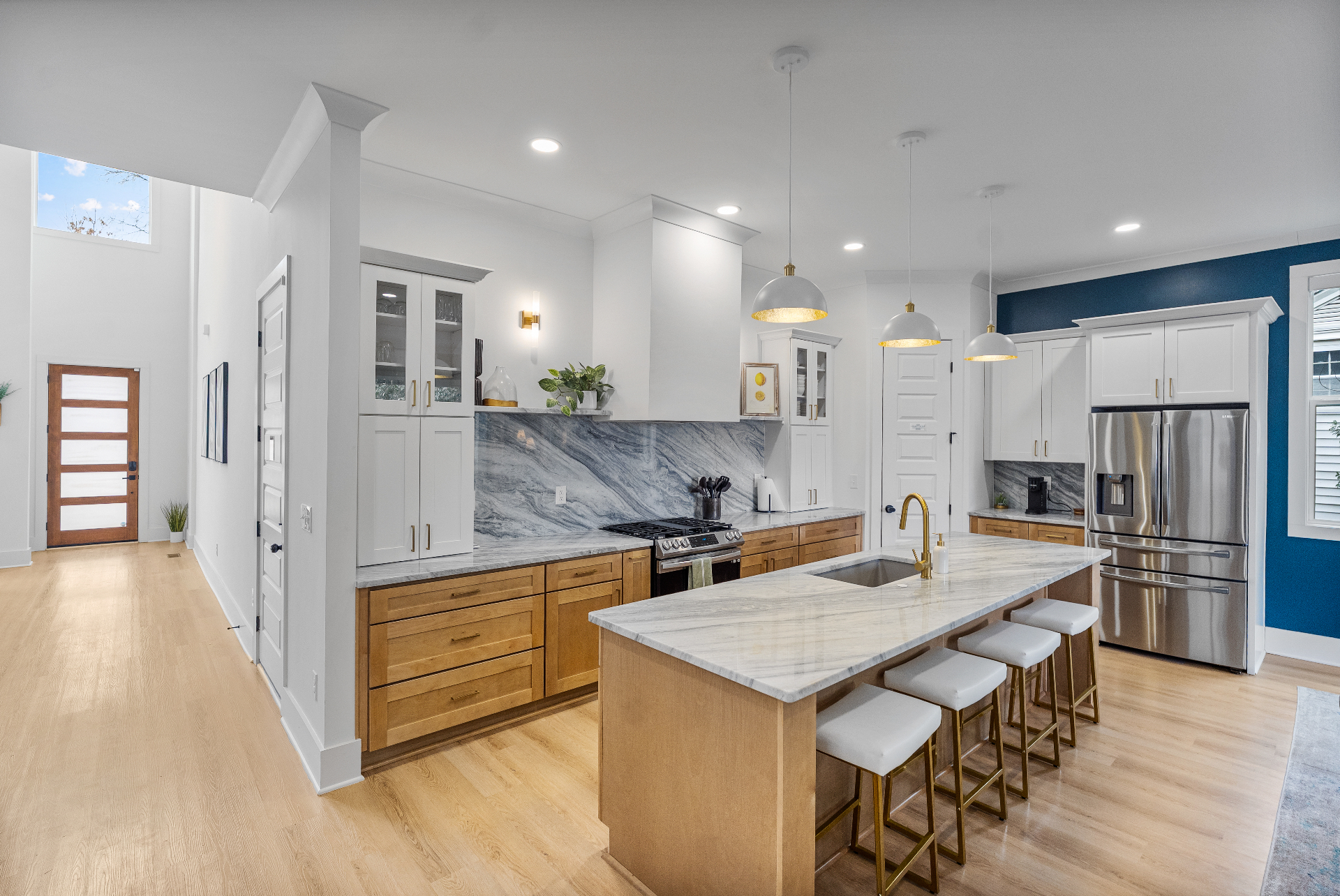 Luxury kitchen with marble island and brass details